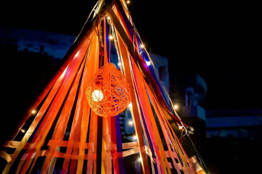 a lit up teepee with a ball on top of it